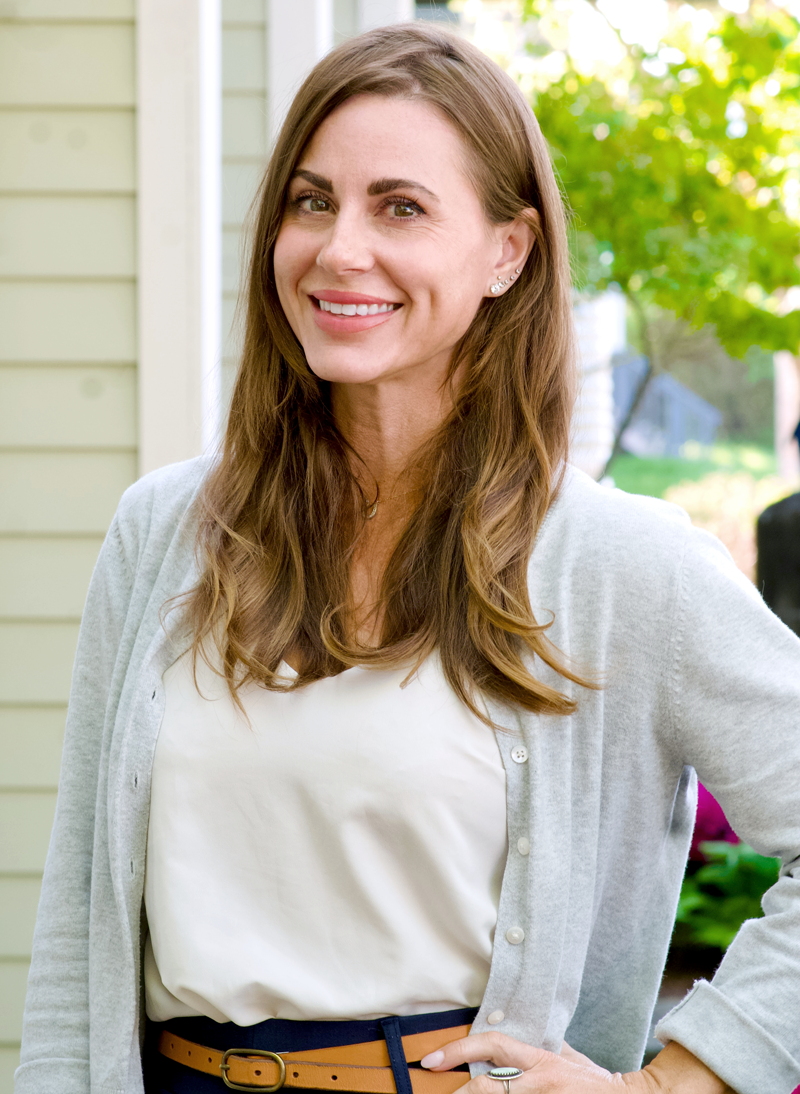 lady smiling with sweater and brown hair