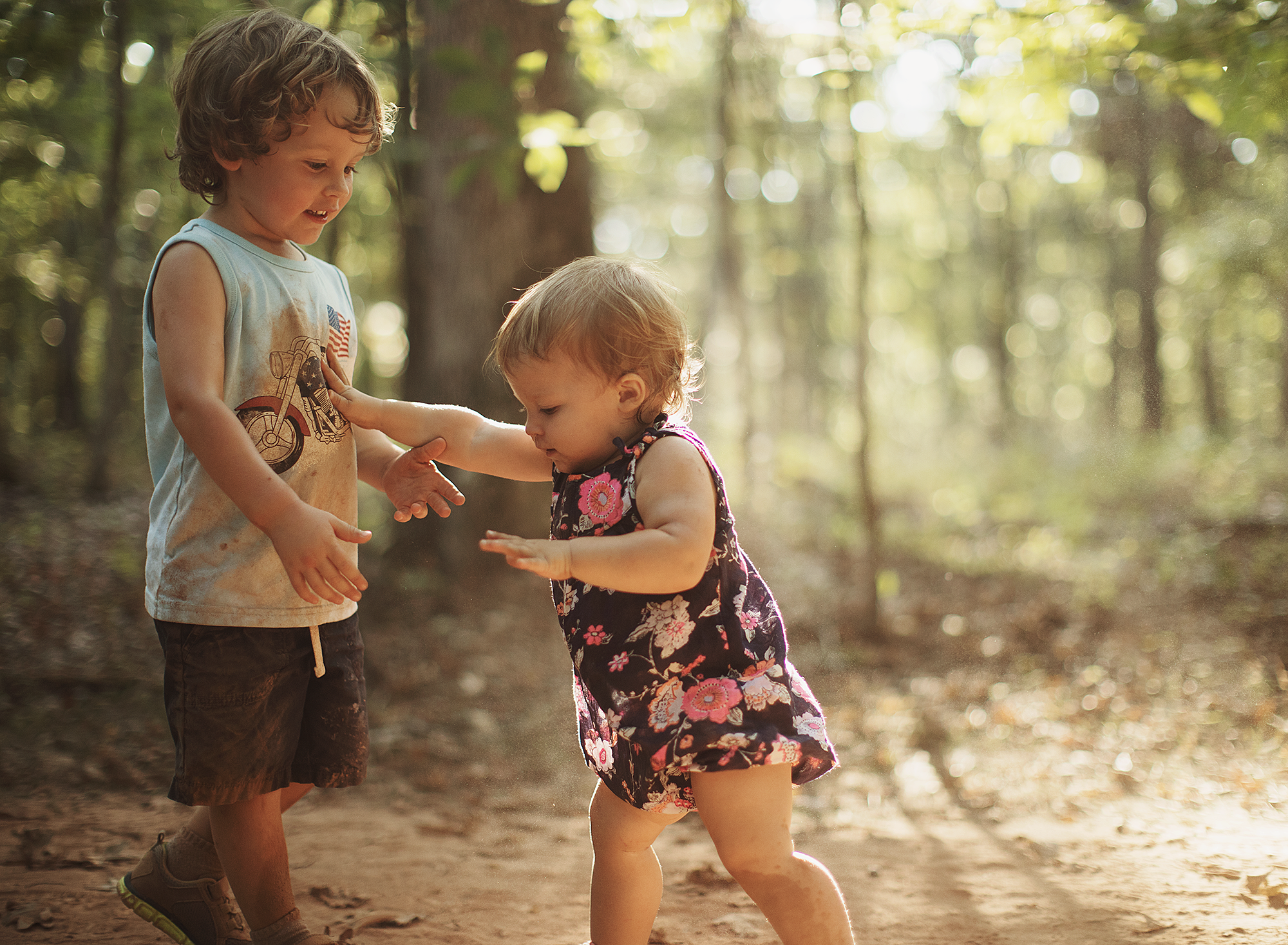 We took an afternoon hike at a nearby trail, as Jacob started messing with the dirt I realized that it softened the light and created a magical atmosphere. So i encouraged him to kick the dirt all over the place while I snapped away, and Fiona gave him the Heisman. We all got super dirty, but it was so worth it.