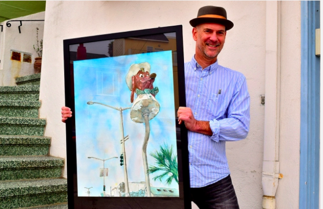 Artist Douglas Gorney holds a painting of the iconic Doggie Diner dachshund head that is located on a pedestal on Sloat Boulevard near the SF Zoo. Photos: Philip Liborio Gangi.