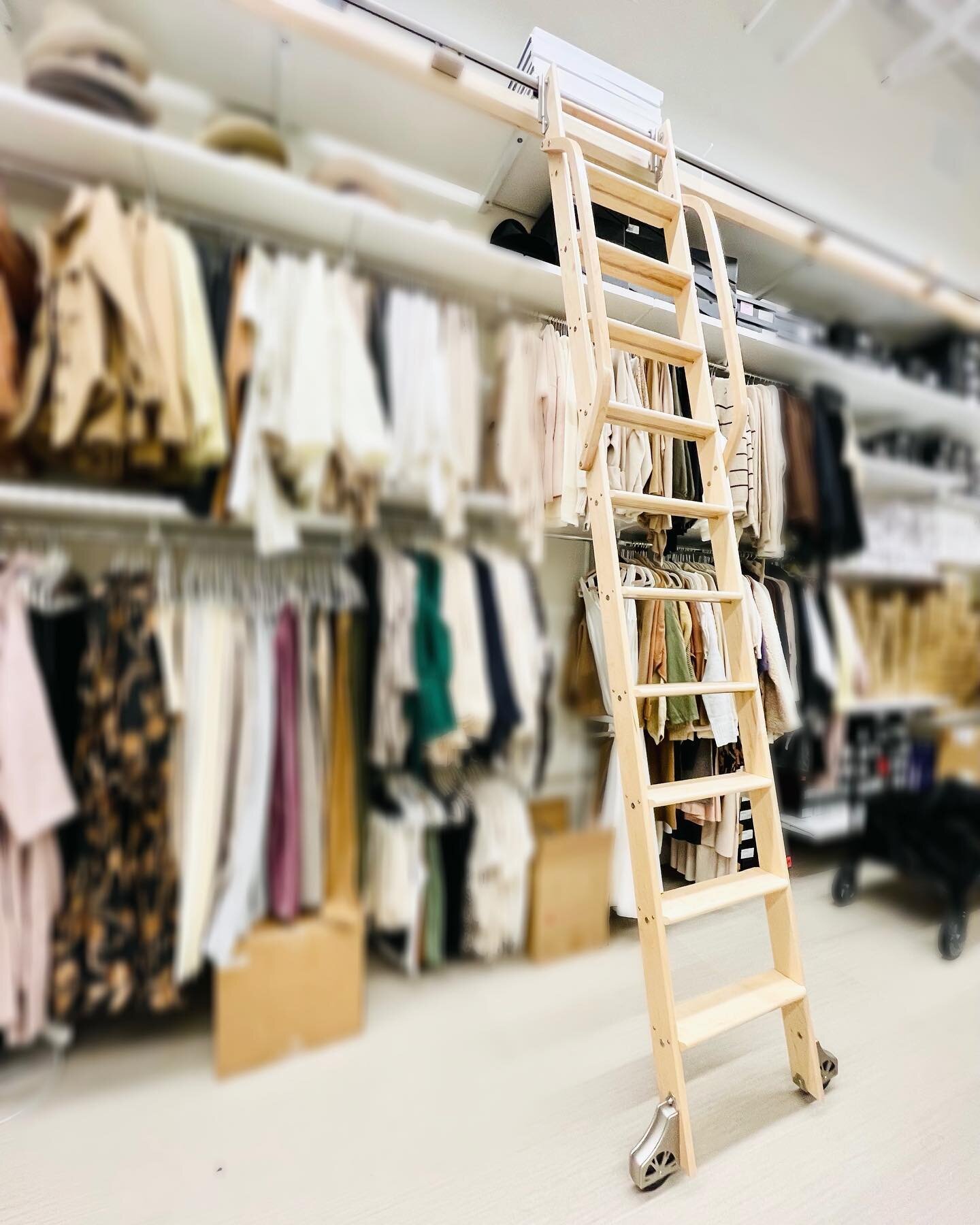 I'm not sure if we channeled our inner Belle or Olivander's, but either way, I custom designed this library ladder to make life easier in the stock room. We maximized space by going up to 10' with the custom shelving system on the wall. The functiona