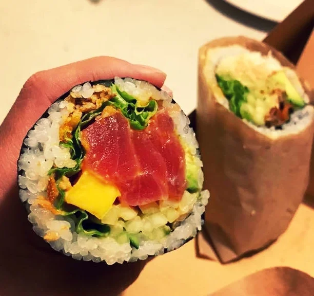 The Mango Ahi Poke B-ritto: Ahi Tuna, Fish Egg, Avocado, Cucumber, Mango, Green Leaf, Fried Onion with Spicy Garlic Sauce