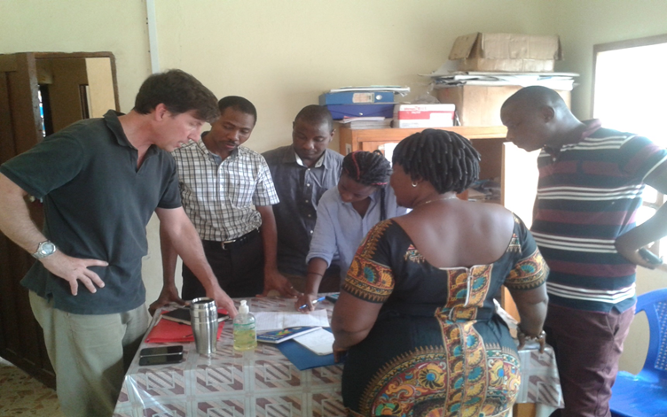 Mentors from the U.S. Centers for Disease Control, Emory University, and eHA help the CHO at Musaia Community Health Center (Koinadugu District) analyze health management information systems data.
