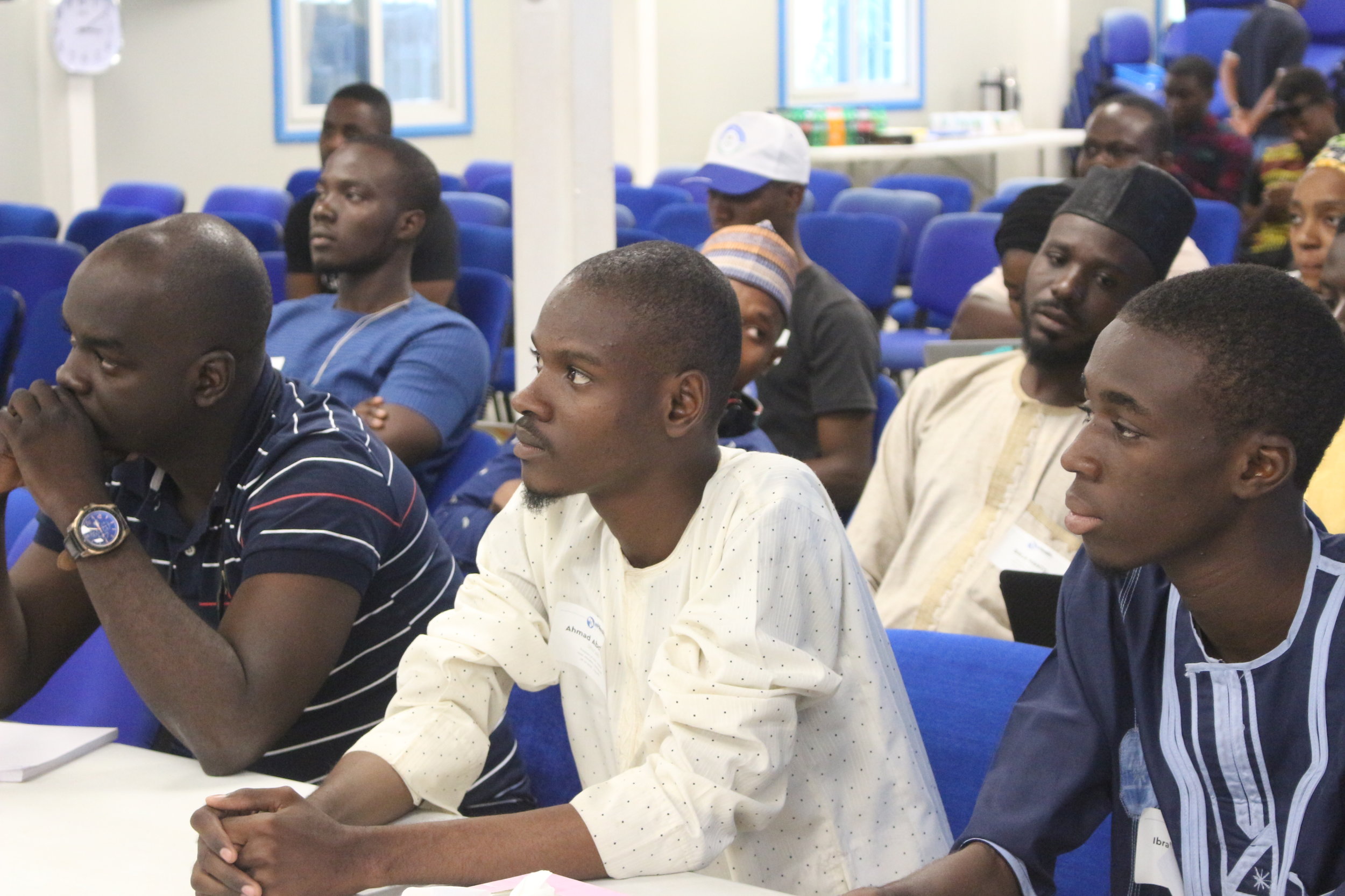     A cross section of the audience listening with rapt attention    