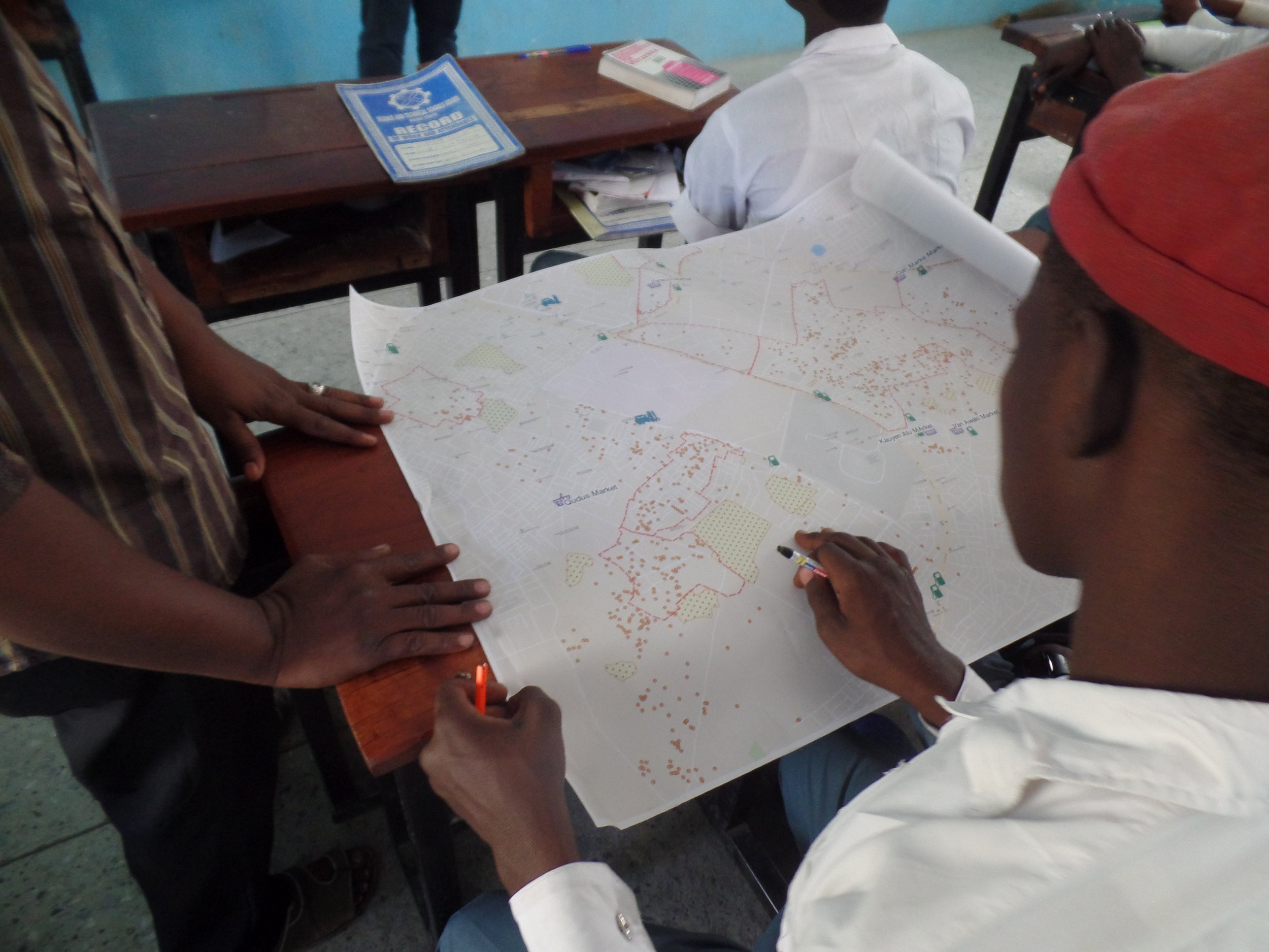  A student identifying geographical features and landmarks on the Kano state Land-use map 