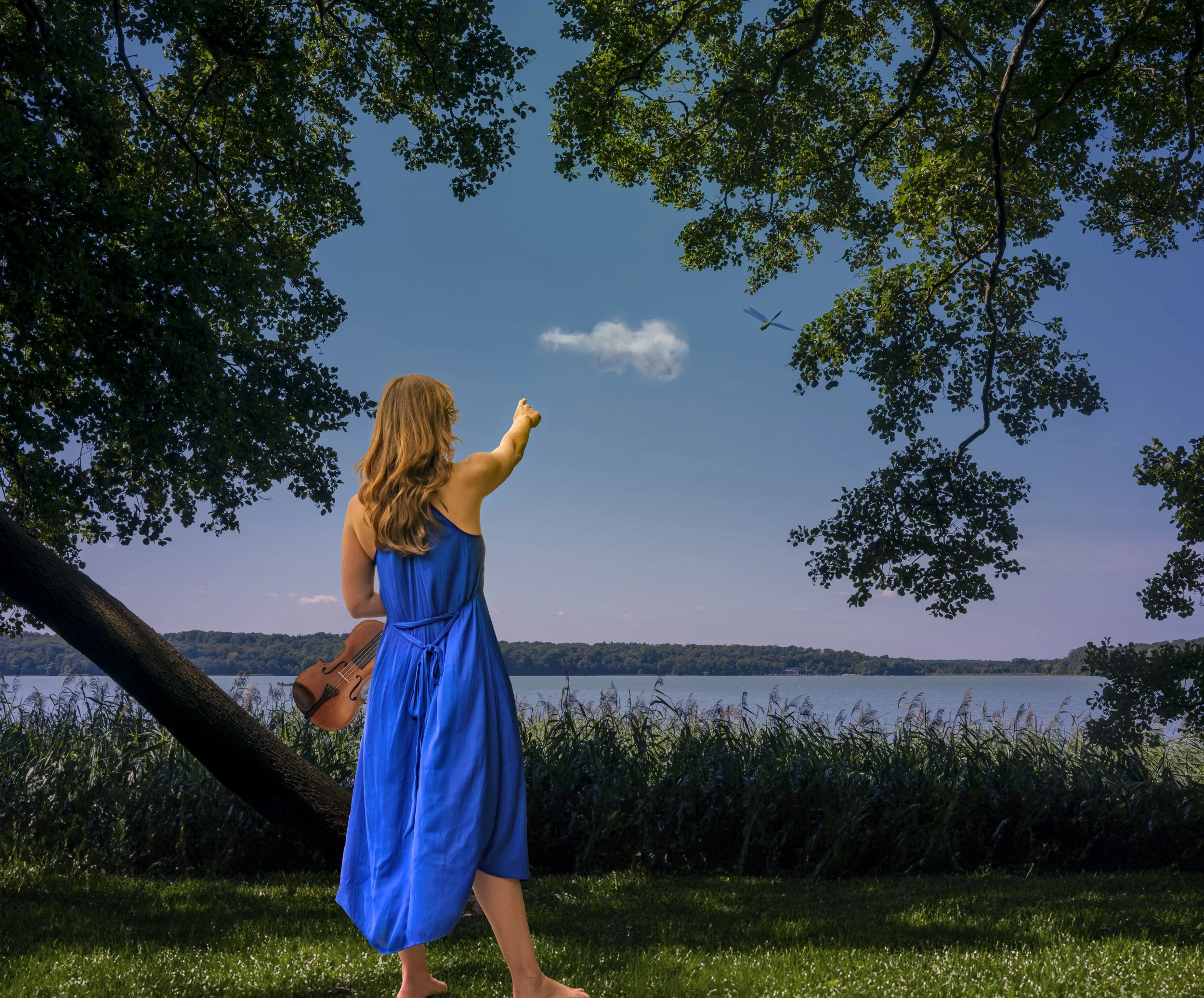 A woman pointing at a cloud