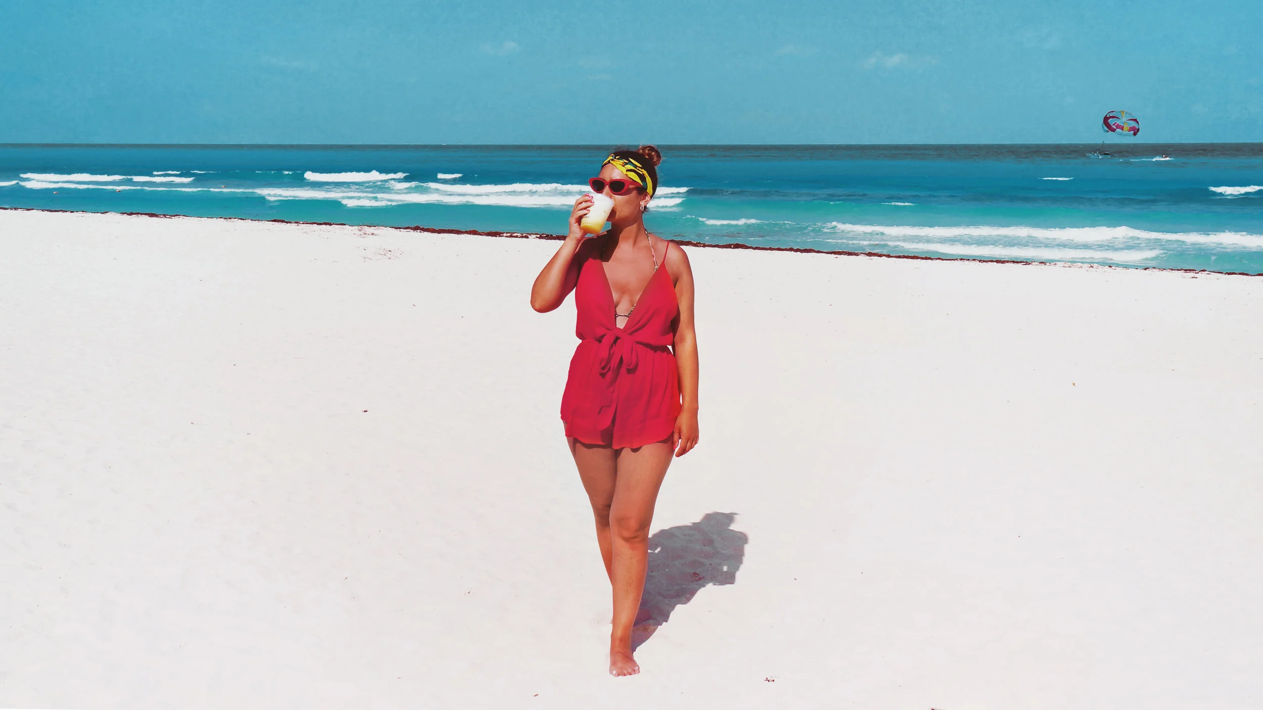 The tie front beach playsuit in red is sold out although it’s still available in black , but if you have your heart set on red here’s a similar one .