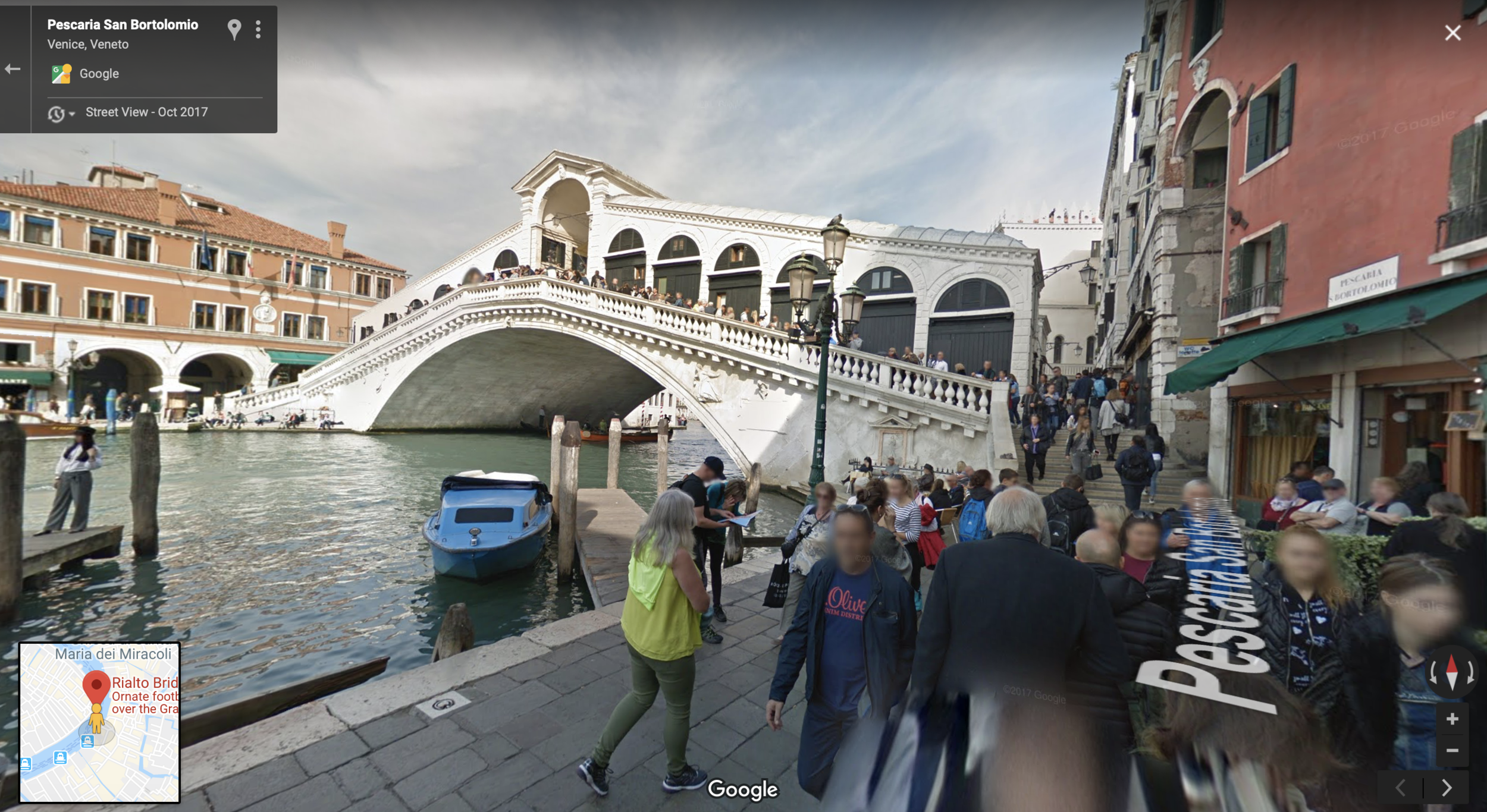 To the right of the blue boat.