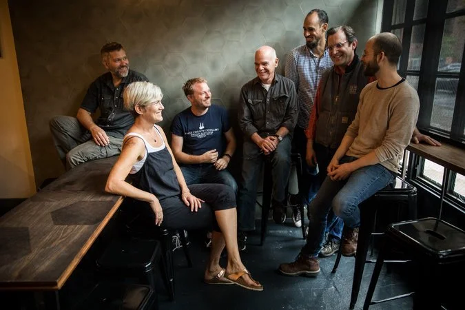 Representatives of the original New York State distilleries producing Empire Rye, gathered at Cardiff Giant, a Brooklyn bar: from left, Daric Schlesselman and Sarah Ludington of Van Brunt Stillhouse; Colin Spoelman, Kings County Distillery; Ralph Erenzo, Tuthilltown Spirits; Christopher Williams, Coppersea Distilling; and Allen Katz and Bill Potter, New York Distilling Company. Not pictured: Nicole Austin of Kings County Distillery, Brian McKenzie of Finger Lakes Distilling and Jason Barrett of Black Button Distilling.