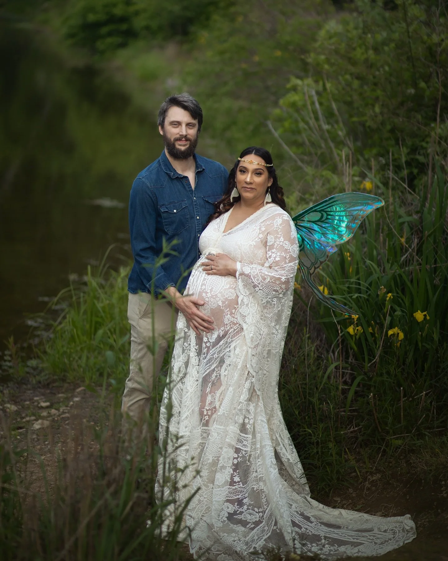 This sweet baby is going to grow up knowing just how magical her momma is! What a beautiful day for this faerie maternity session. The flowers stayed around just long enough for us to play with them. 🌼🧚&zwj;♂️🌿

Photography, faerie wings, and crow