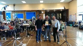 John Myles and Morgan Griffiths in front of the band