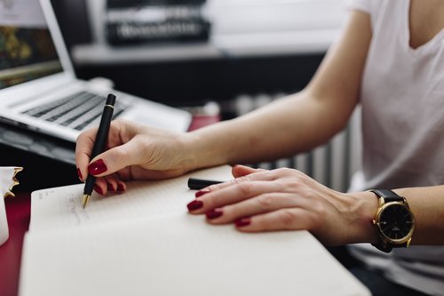 kaboompics_Woman+writing+on+notebook-2.jpg