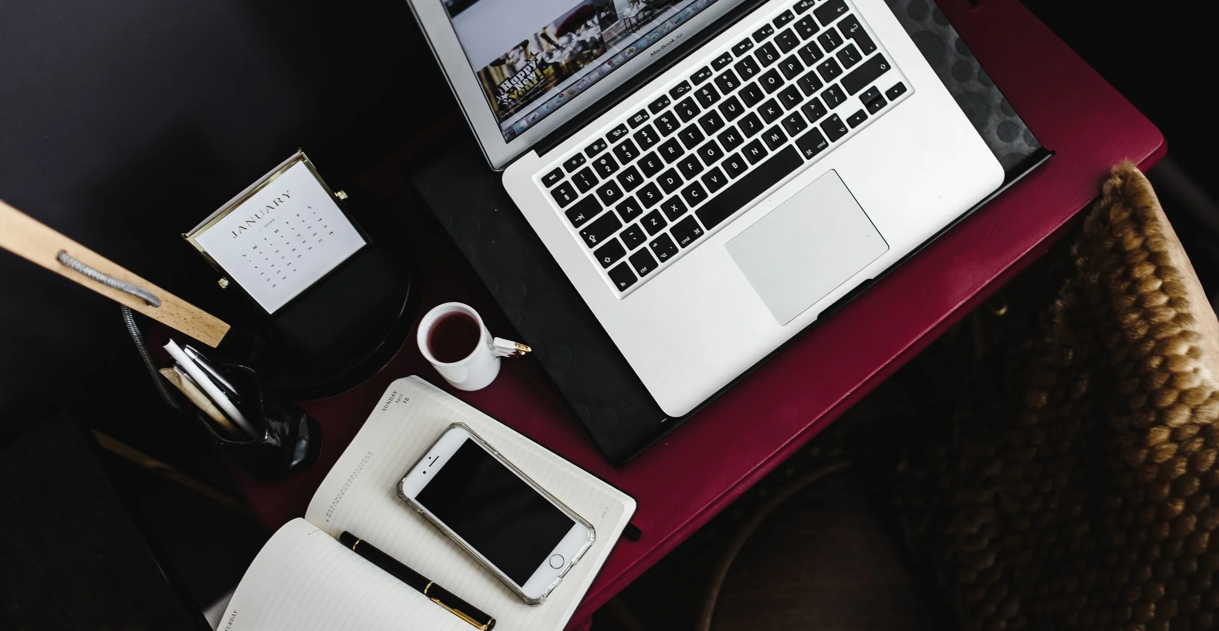 kaboompics_Macbook Air and iPhone 6 on the pink desk.jpg