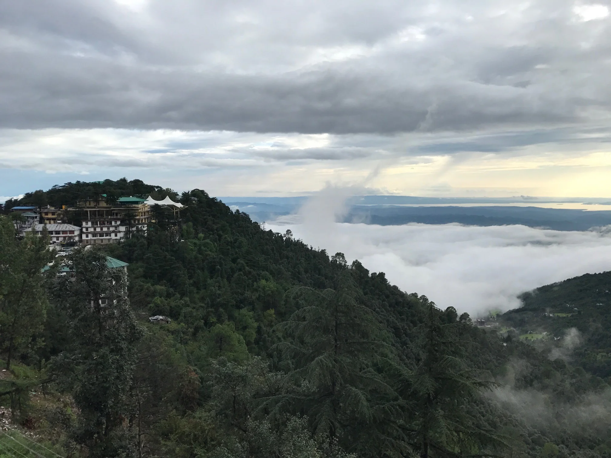 The building with the white canvas roof is the Dalai Lama's temple.