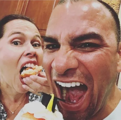 Joaquin Munoz devouring graduation party cupcakes with wife, Anna