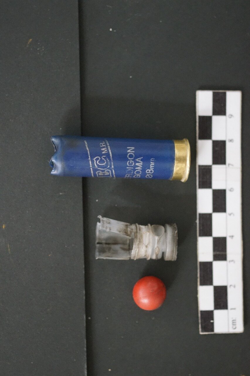 Shotgun shell, wadding, and plastic ball