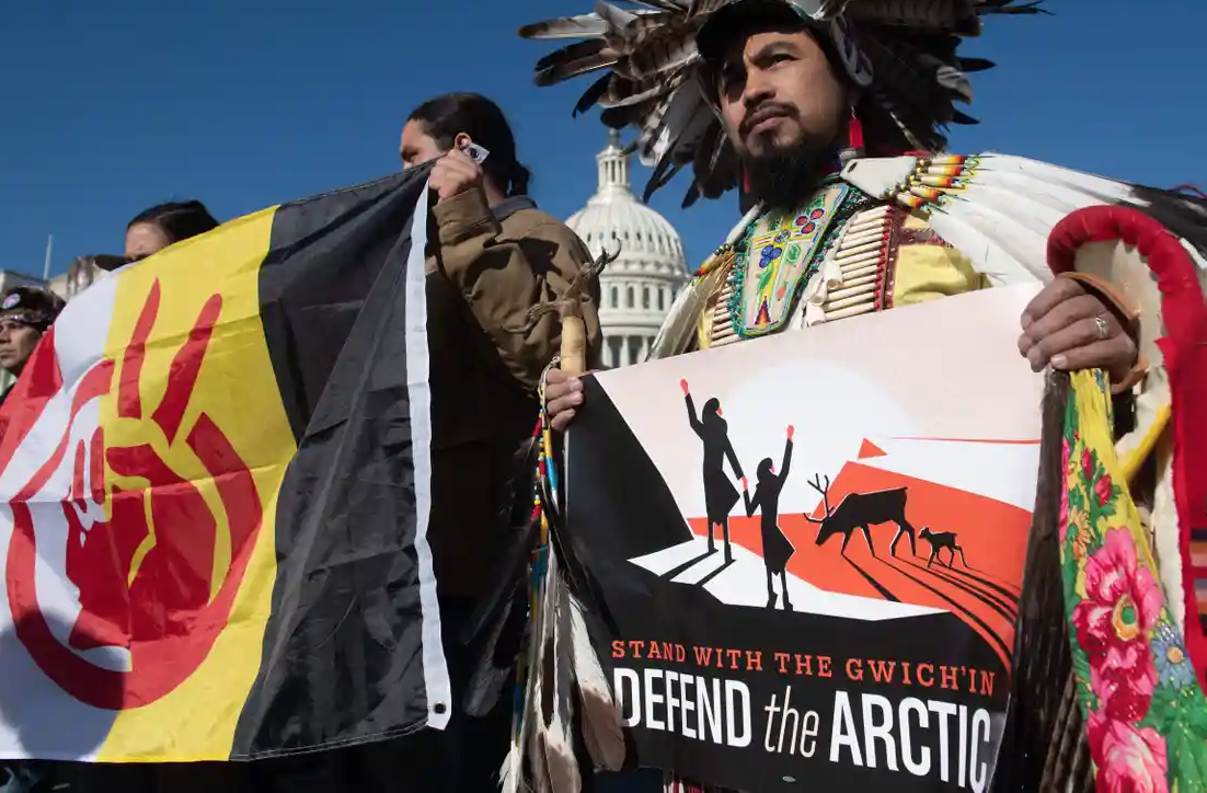 Native American leaders hold signs against drilling in the Arctic refuge outside the Capitol in Washington DC on 11 December. Photograph: Saul Loeb/AFP/Getty Images