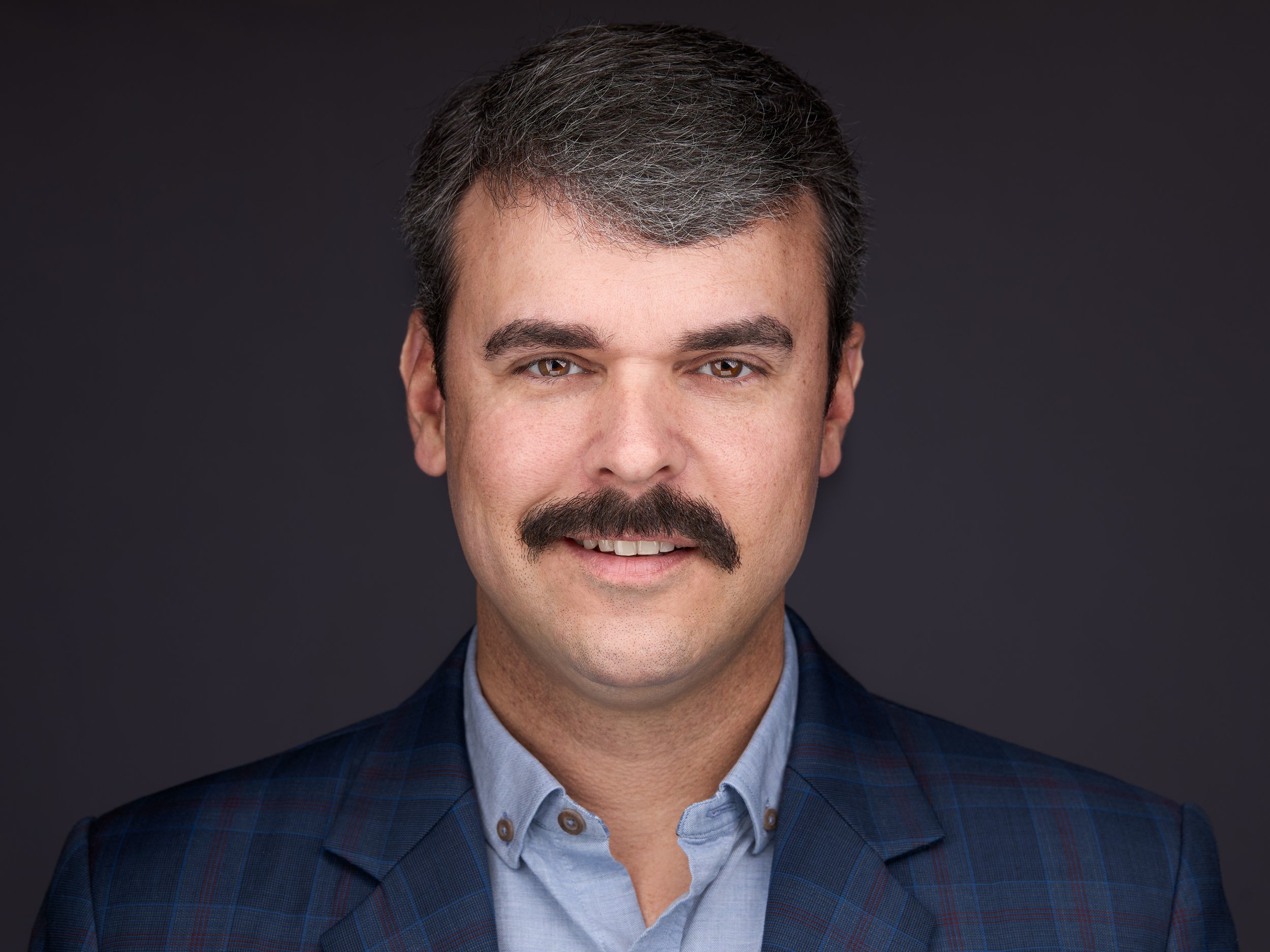 brandon triangle headshot.jpg