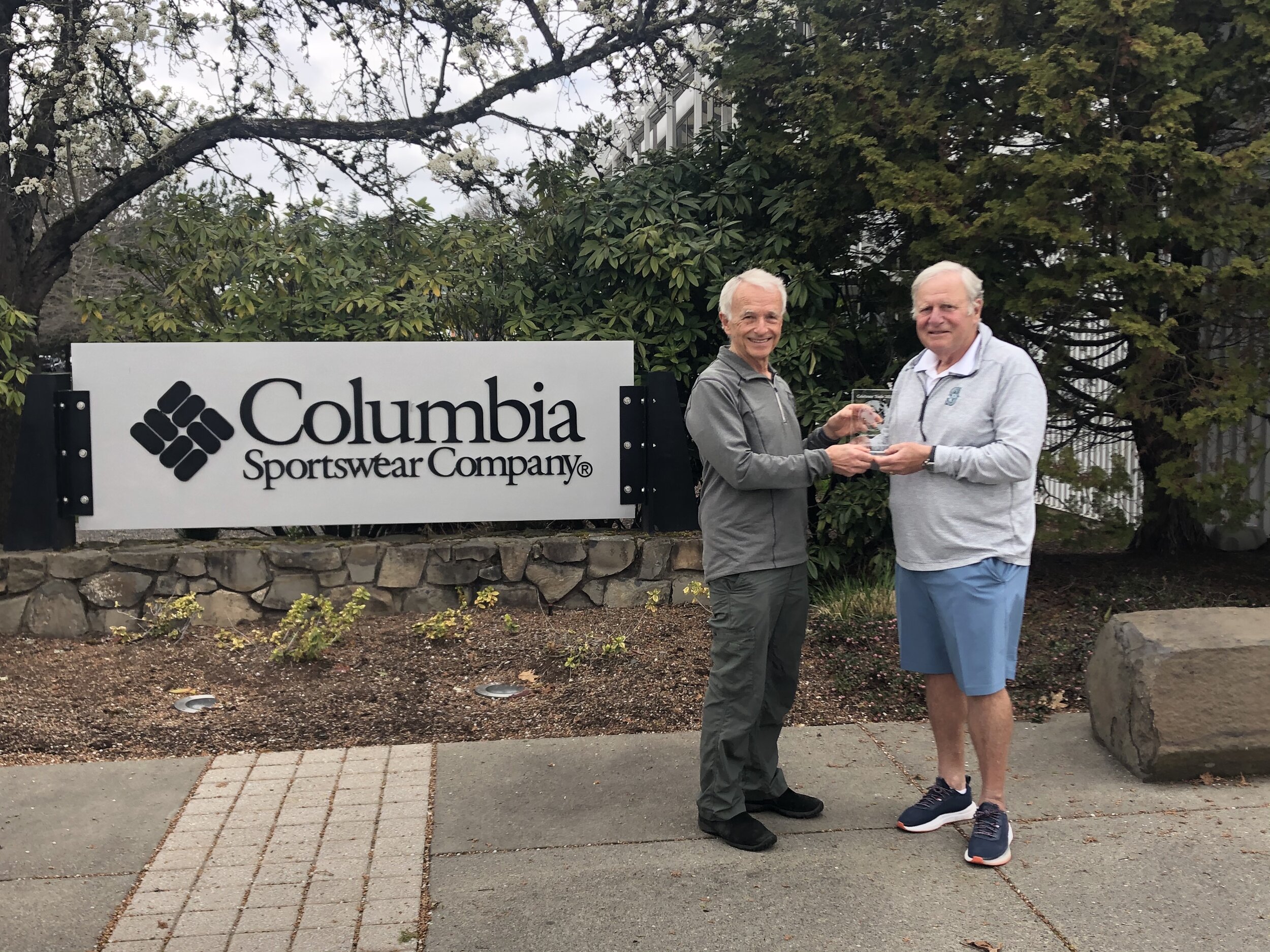  Randy Miller of the Oregon Consular Corps (L) presents the Celebrate Trade Award to Tim Boyle, Chairman of Columbia Sportswear. 