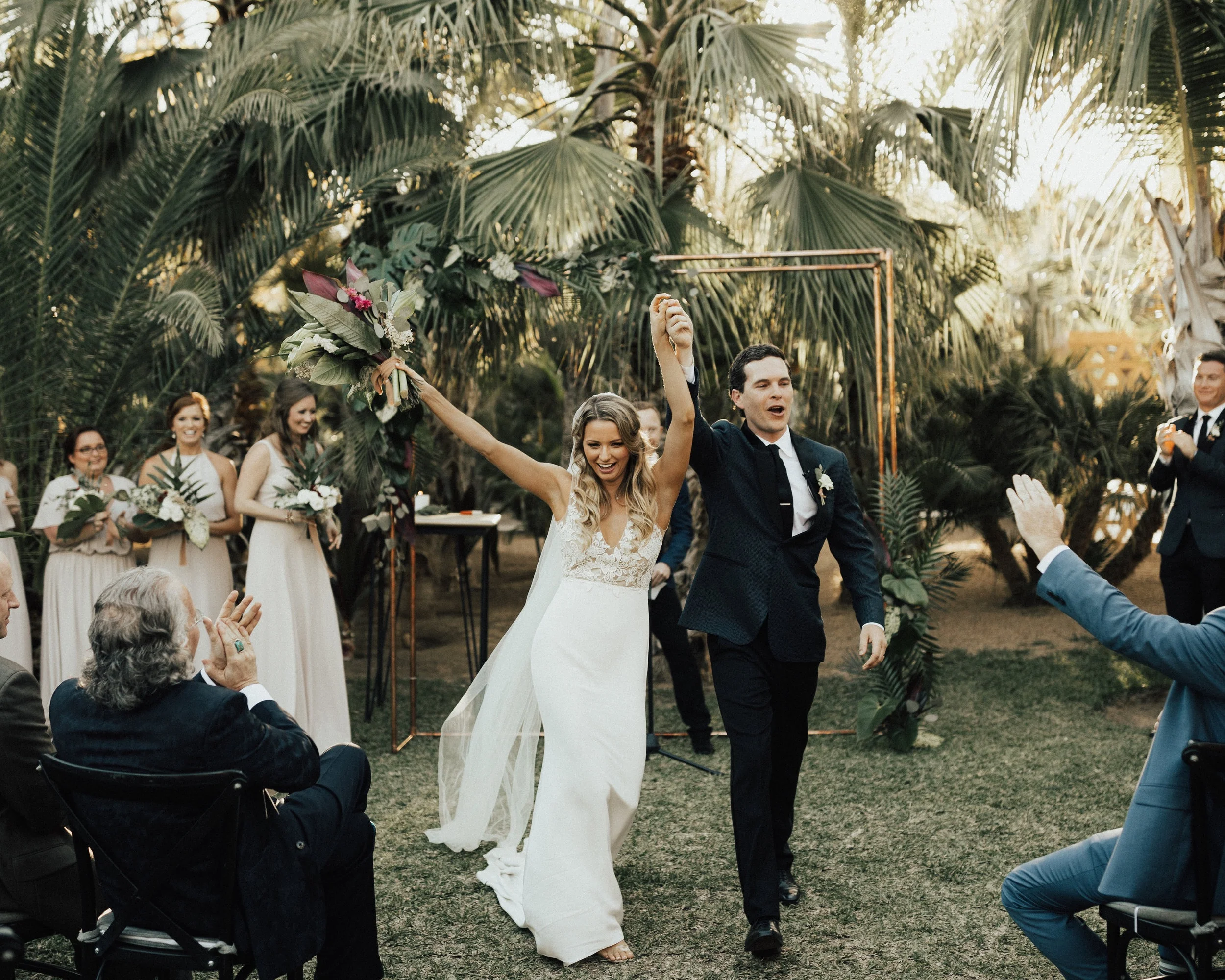 Jamie & Blake’s primary focus was finding a venue that was both naturally beautiful and a place where their guests would have an amazing time. Acre Baja in San Jose del Cabo was the perfect location. The space had a farm-to-table restaurant, treehouse resort, and gorgeous wedding venue. It was love at first sight - from the palm tree jungle to the mango orchard that lit up at night. One of their favorite moments was entering the reception through a path lined with family & friends with sparklers. This led into the couple’s first dance, featuring a surprise saxophone player to Stevie Wonder’s ‘For Once in My Life’. It was everything they dreamt of and more.