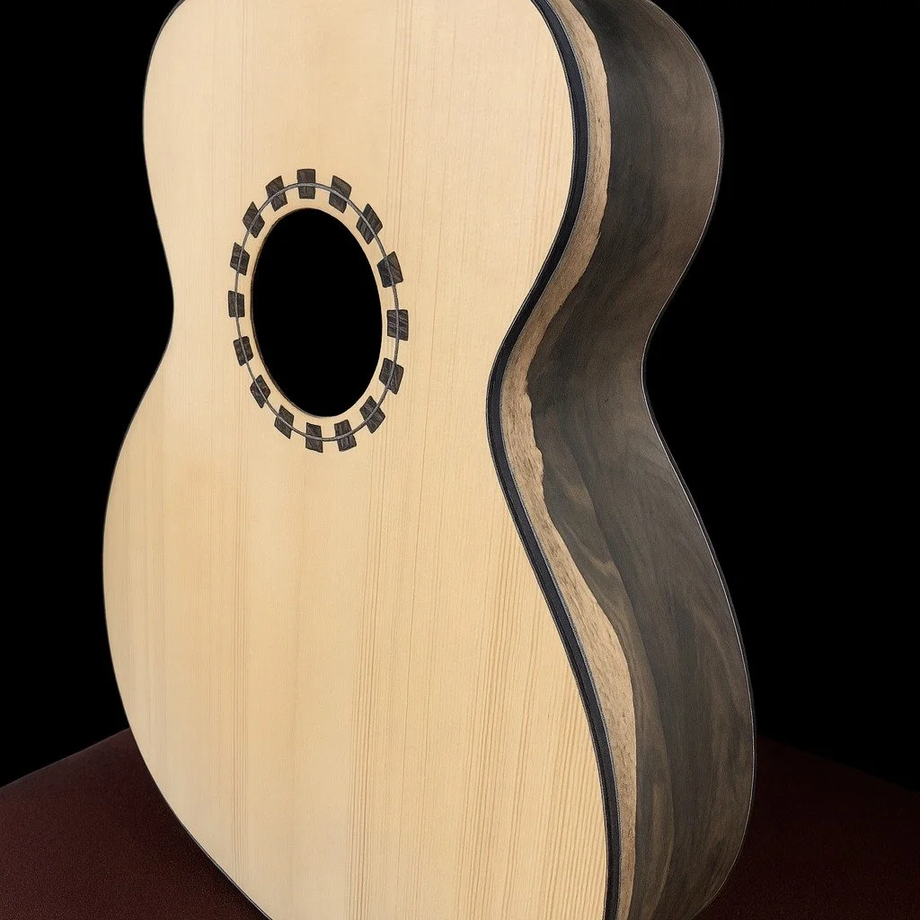 These two guitars will be available soon at www.ceolaguitars.com! Ziricote with German spruce, and Indian Rosewood with Adirondack spruce. (AI blacked out the background and made it a touch animated but they're very accurate to the actual look)
#acou