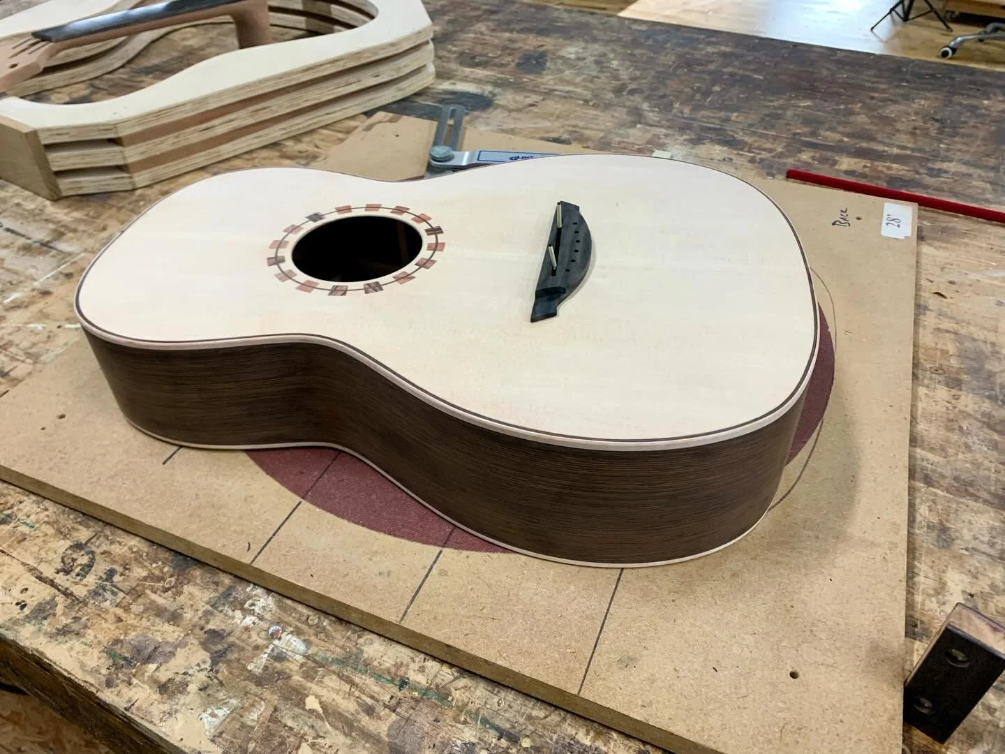 Here&rsquo;s a couple guitars on the work bench. A traveler parlor, and an artisan S1! Check us out at www.ceolaguitars.com #luthier #handmade #guitar #acoustic #artisan