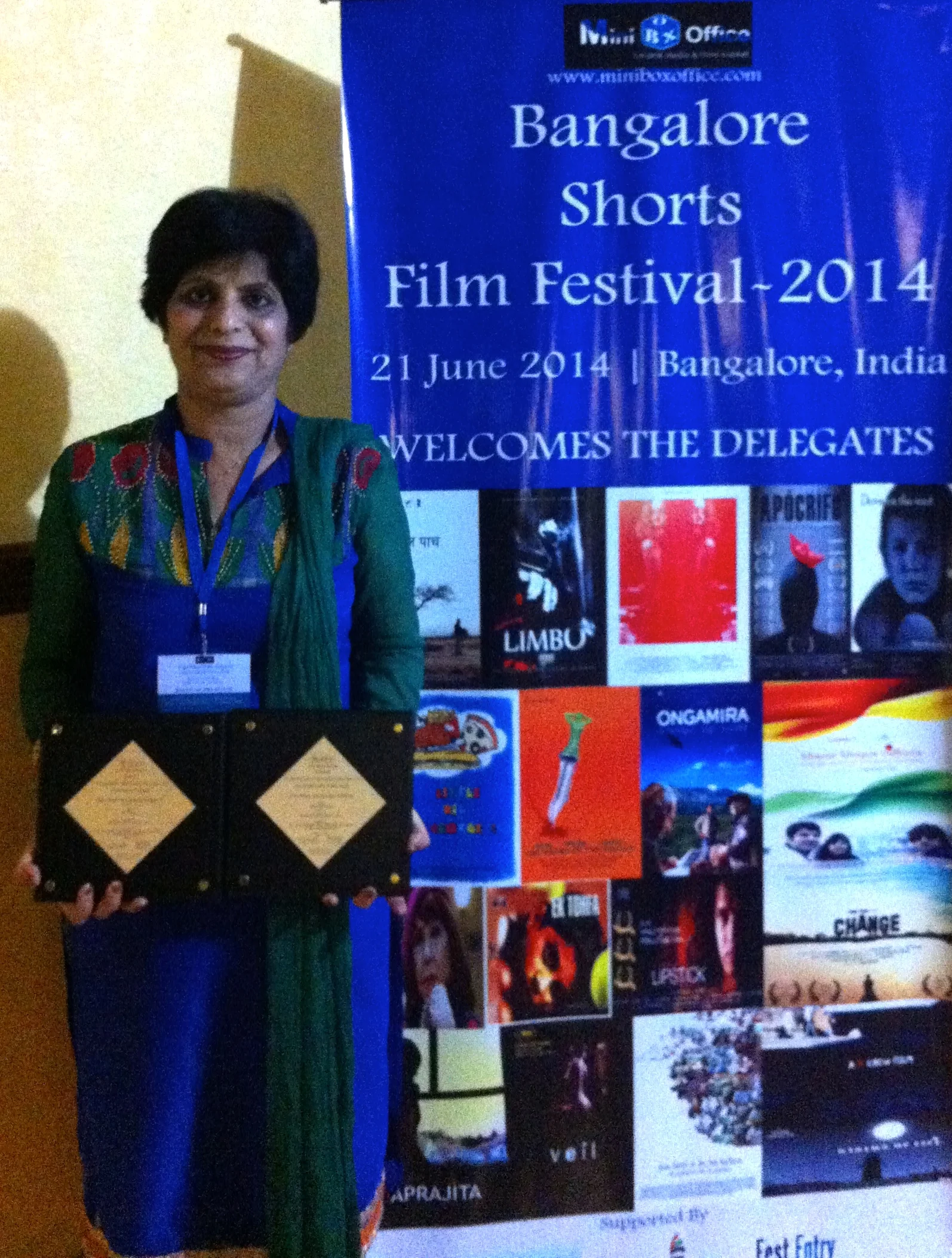 Falun Dafa practitioner receiving the award the Best Music Award at the Bangalore Shorts Film Festival on the behalf of Free China: The Courage to Believe in Bangalore, India. (Credit: Falun Dafa Association of India)