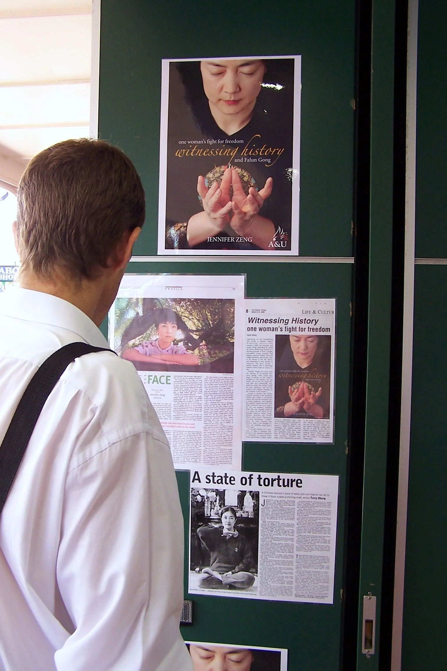 A reader reading media coverage of Jennifer's book at a bookstore in Gold Coast, QLD, Australia in May, 2005