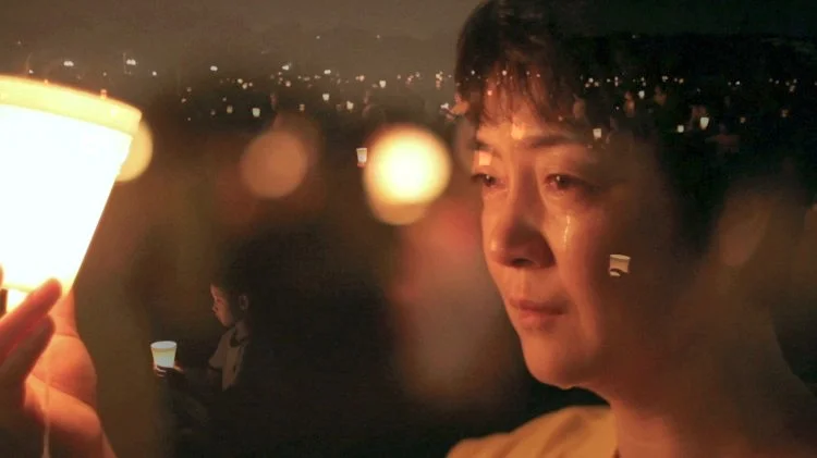 Jennifer Zeng sheds tears during a candlelight vigil in Washington, D.C. for Falun Gong practitioners persecuted in China. (Courtesy of NTD Television)