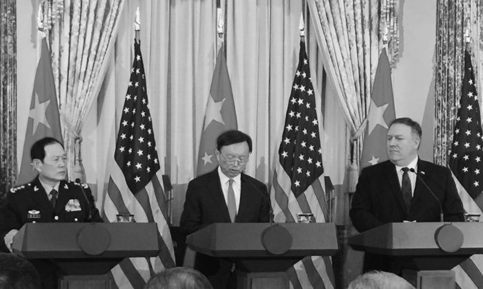 Director of the Office of Foreign Affairs Yang Jiechi (C) reads from a script in answer to a question at the U.S.-China Diplomatic Security Dialogue in Washington on Nov. 9, 2018. (Jennifer Zeng/The Epoch Times)