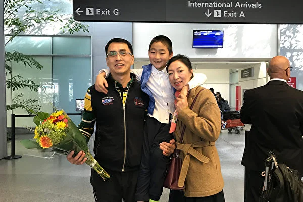 Yu Ming is greeted by his wife and son at San Francisco International Airport on Jan. 27, 2019. (The Epoch Times)