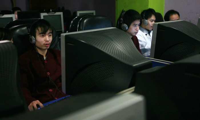 Chinese youths surf the internet in a net cafe on January 21, 2008 in Chongqing Municipality, China. (China Photos/Getty Images)