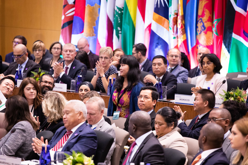 Manping Ouyang, a Christian survivor of the Chinese Communist Party’s religious persecution, stands after being acknowledged by Vice President Pence, at the Ministerial to Advance Religious Freedom in Washington on July 18, 2019. (Lynn Lin/Epoch Times)