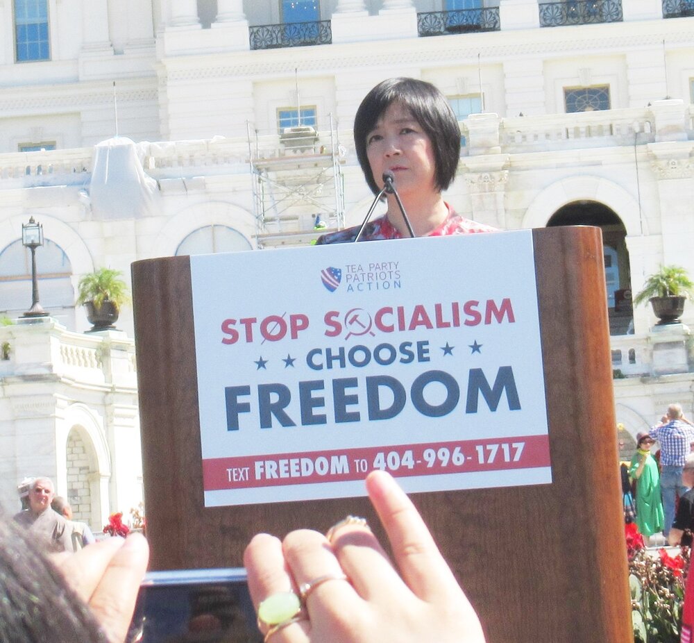 Jennifer speaks at “Stop Socialism Choose Freedom” rally at Washington DC on Sep. 19, 2019. Credit: Facebook of  John Overingto )