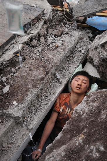 A boy buried in the collapsed building during the earthquake in May 2008 in Sichuan Province, China.