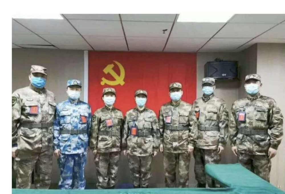 Chen Wei and the other 6 CCP members standing in front of the CCP flag before or after they received the vaccine. 