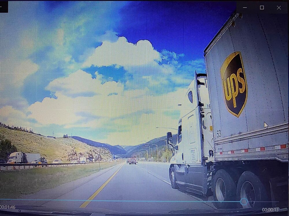 On June 30, car camera footage shows a UPS truck suddenly cut into Guppy Dong’s lane.  Source:   Guppy Dong’s Facebook page