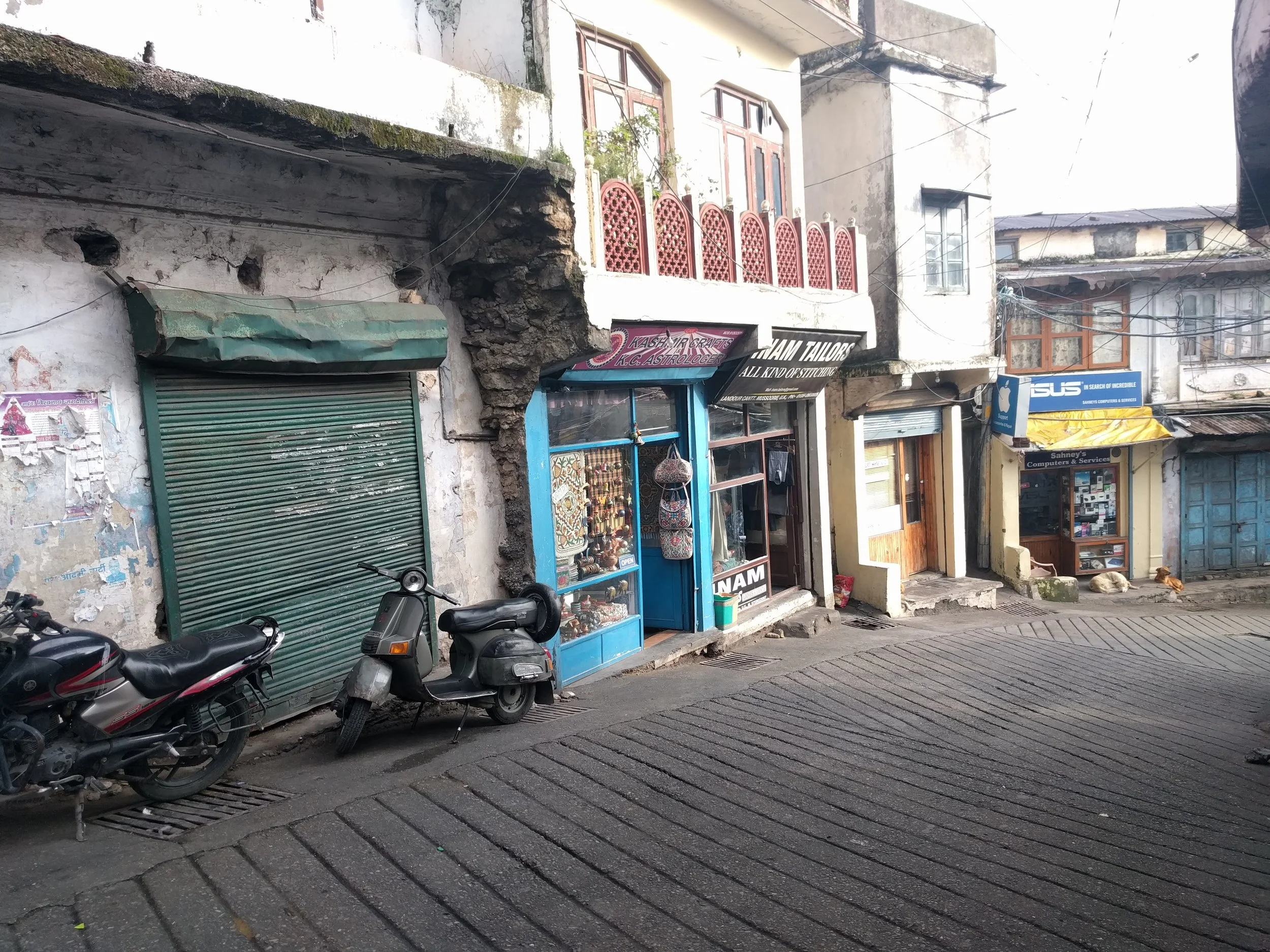 A few Mussoorie shopfronts, including "our" tailor and electronics store