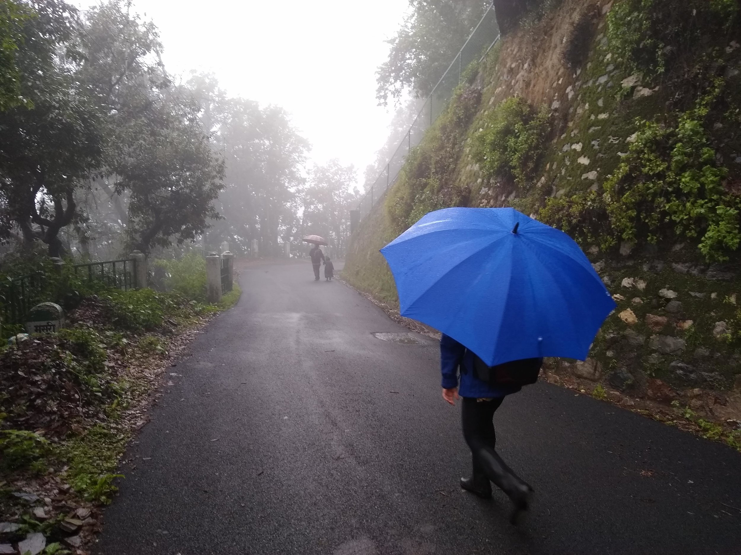 After 10 minutes of moderate downhill switchbacks, we walk another 10 minutes on a paved road to school.