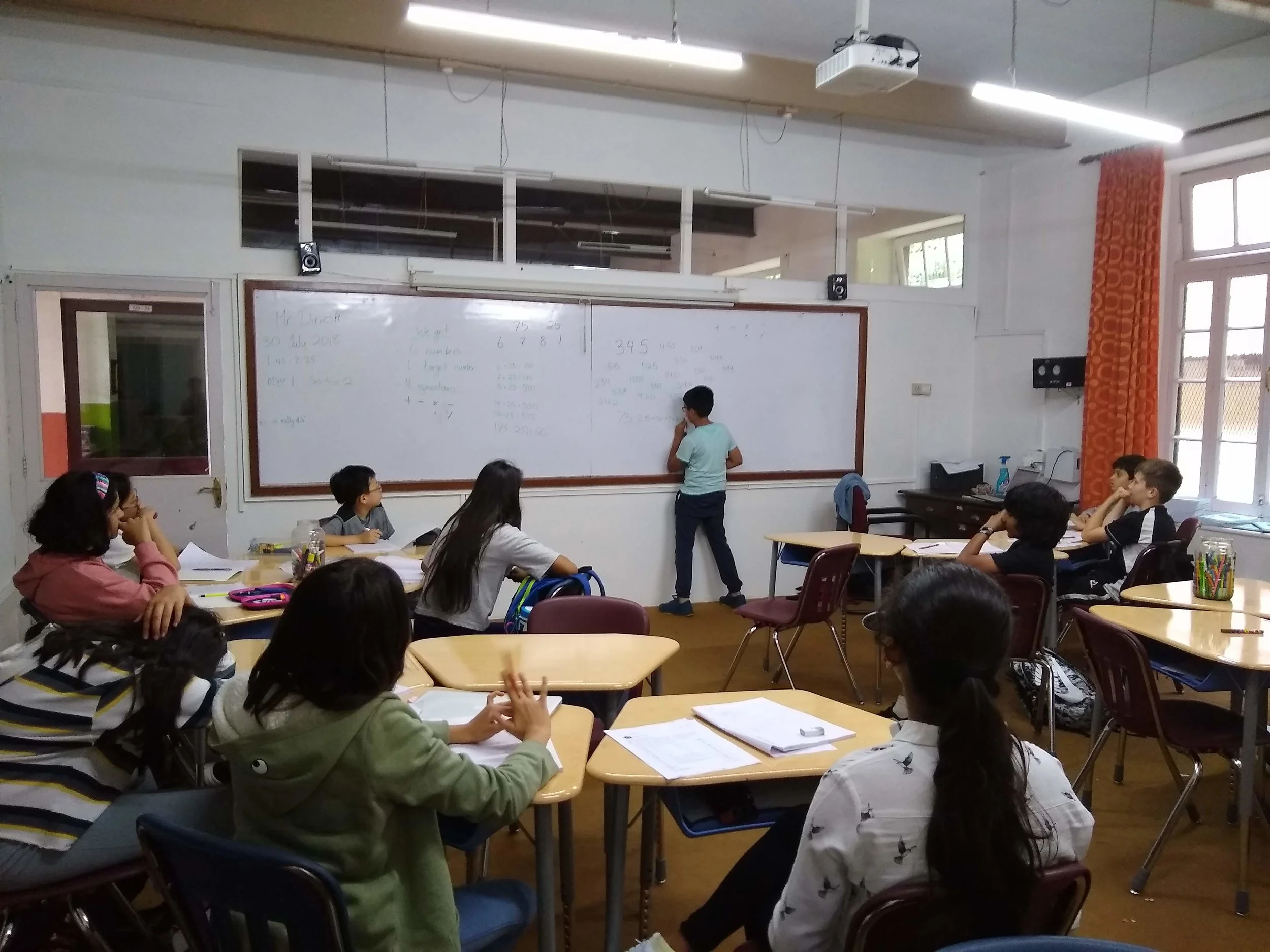 Some of our 6th-grade students doing math in Dinesh's classoom