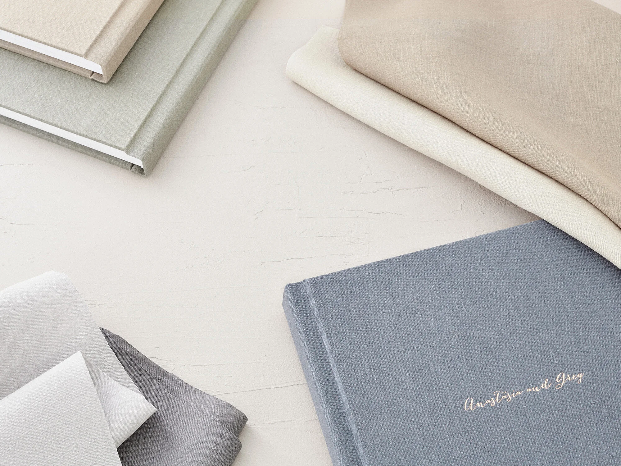 Linen albums have the additional options of gold, silver, or rose gold foil debossing, in addition to standard “blind” debossing (no color added).