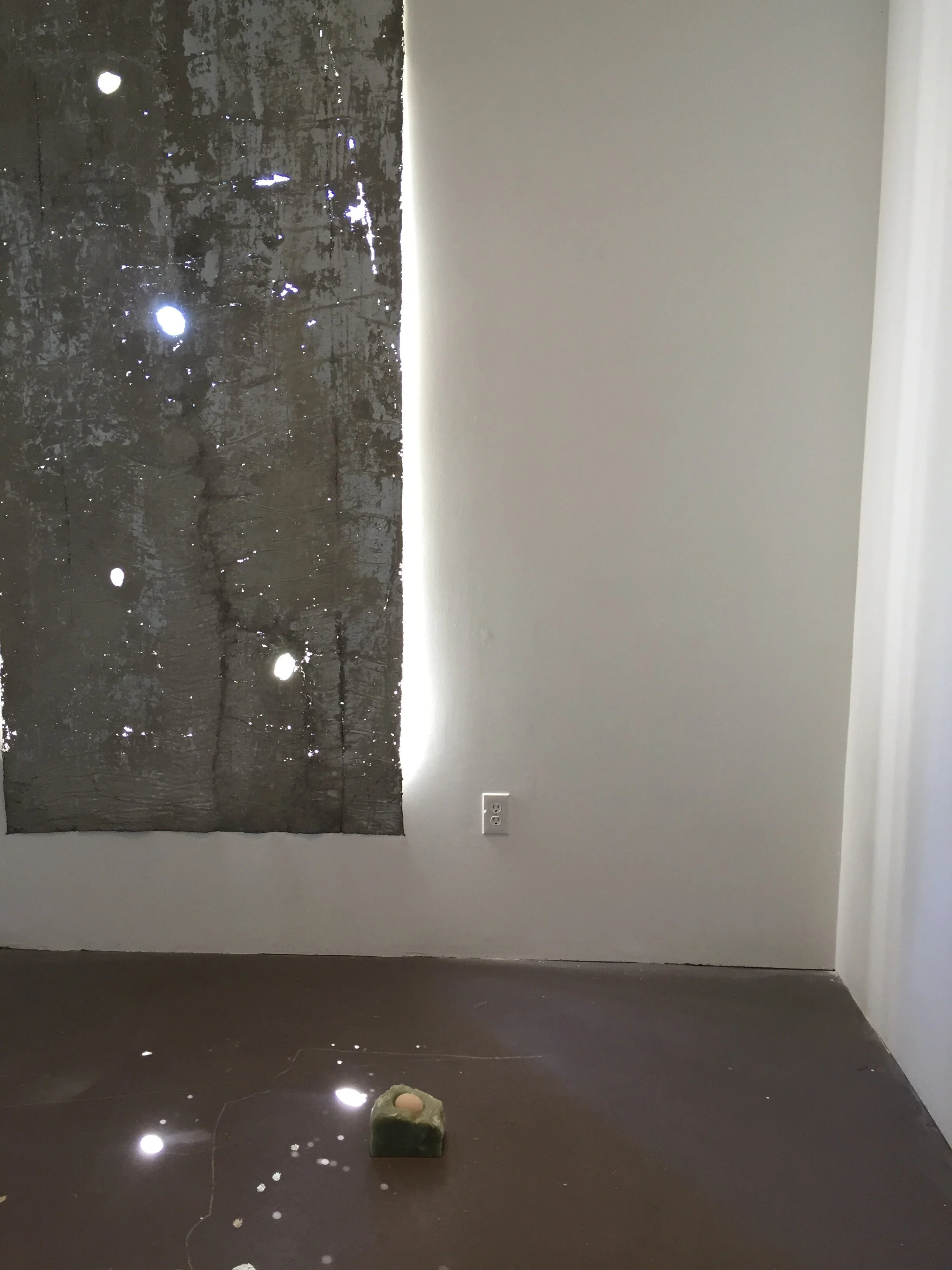  Marie Bannerot McInerney,  No Stars till You Go to the Country,  2017, concrete, cotton, gold, silver, graphite, charcoal, light, and time / Catalina Ouyang,  font II,  2016, raw egg, white vinegar, soapstone, beeswax 