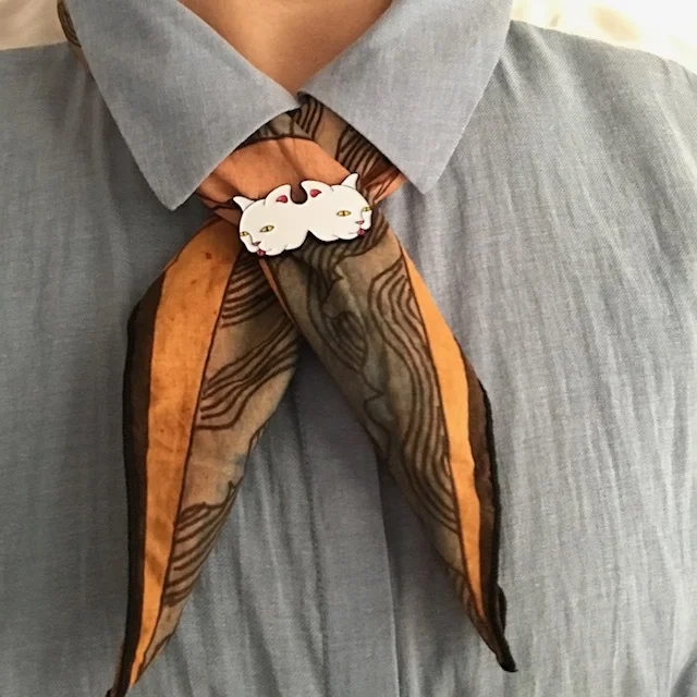 Scouts Honor. Looking sweet paired with the Siamese Kitty Lapel Pin.