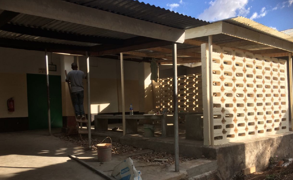 The outdoor waiting area with solar shading creating a comfortable place to sit and wait