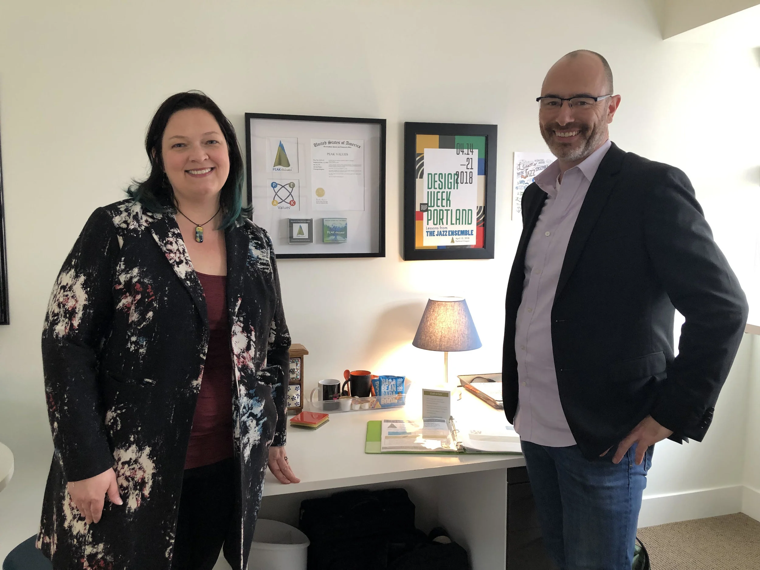 Jen Coyne and Brian Stinson, Co-Founders of The Peak Fleet, getting ready for an open house during Design Week in their Portland office.