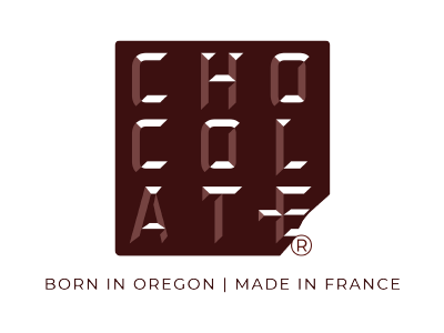 CHOCOLAT-E logo in a stylized font, with the text 'BORN IN OREGON | MADE IN FRANCE' below.