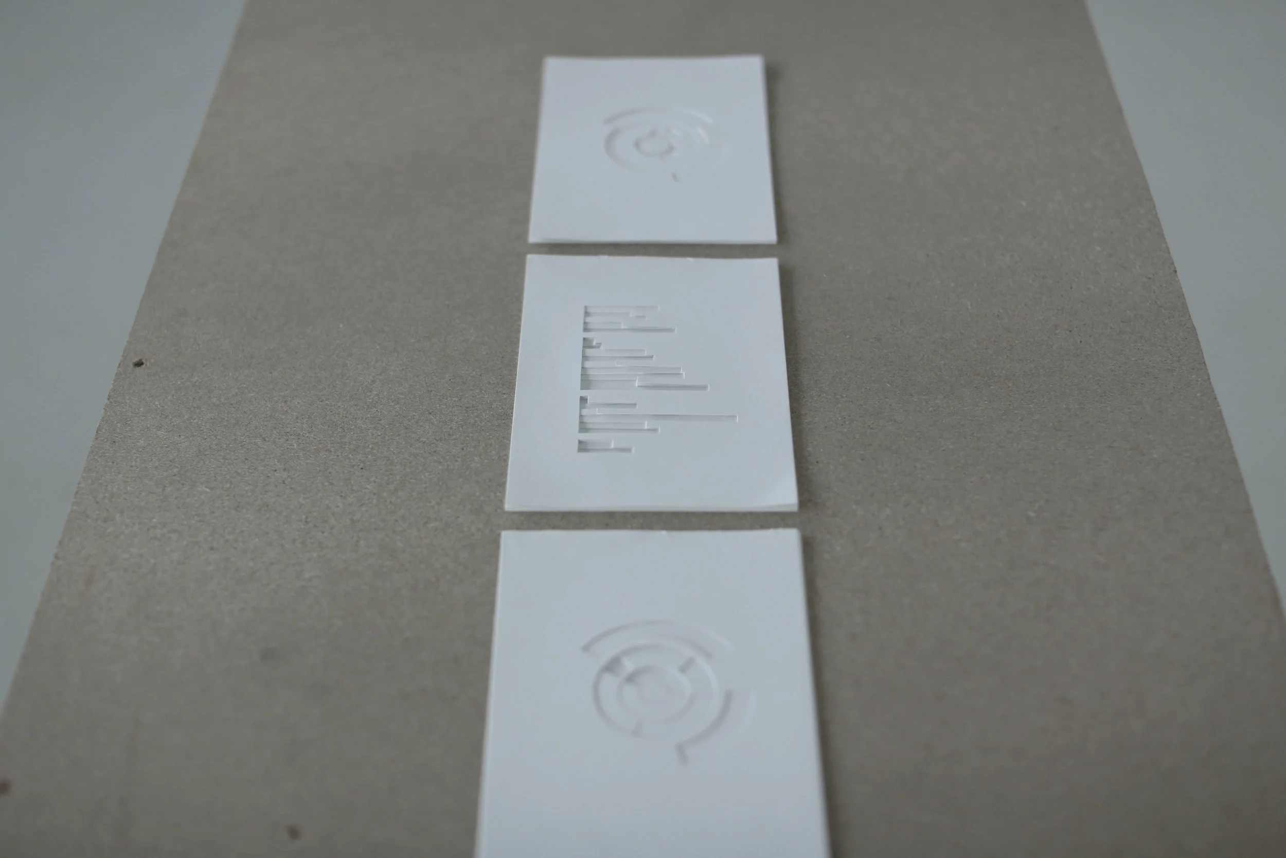  A meticulous, comparative, visual, statistical representation of vast volumes of data, retrieved from crucial archival documents and from personal memory and knowledge. (Selection of three). Installation of cut carton on wooden table. 1480 x 600 x 7