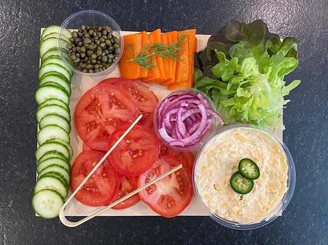 Our veggie board comes with cucumbers, lettuce, tomatoes, capers, pickled red onions, cured carrot &ldquo;lox&rdquo; and your choice of veggie cream cheese or our jalape&ntilde;o cheddar spread (similar to pimento cheese, but with a bit more 🌶🔥 hea