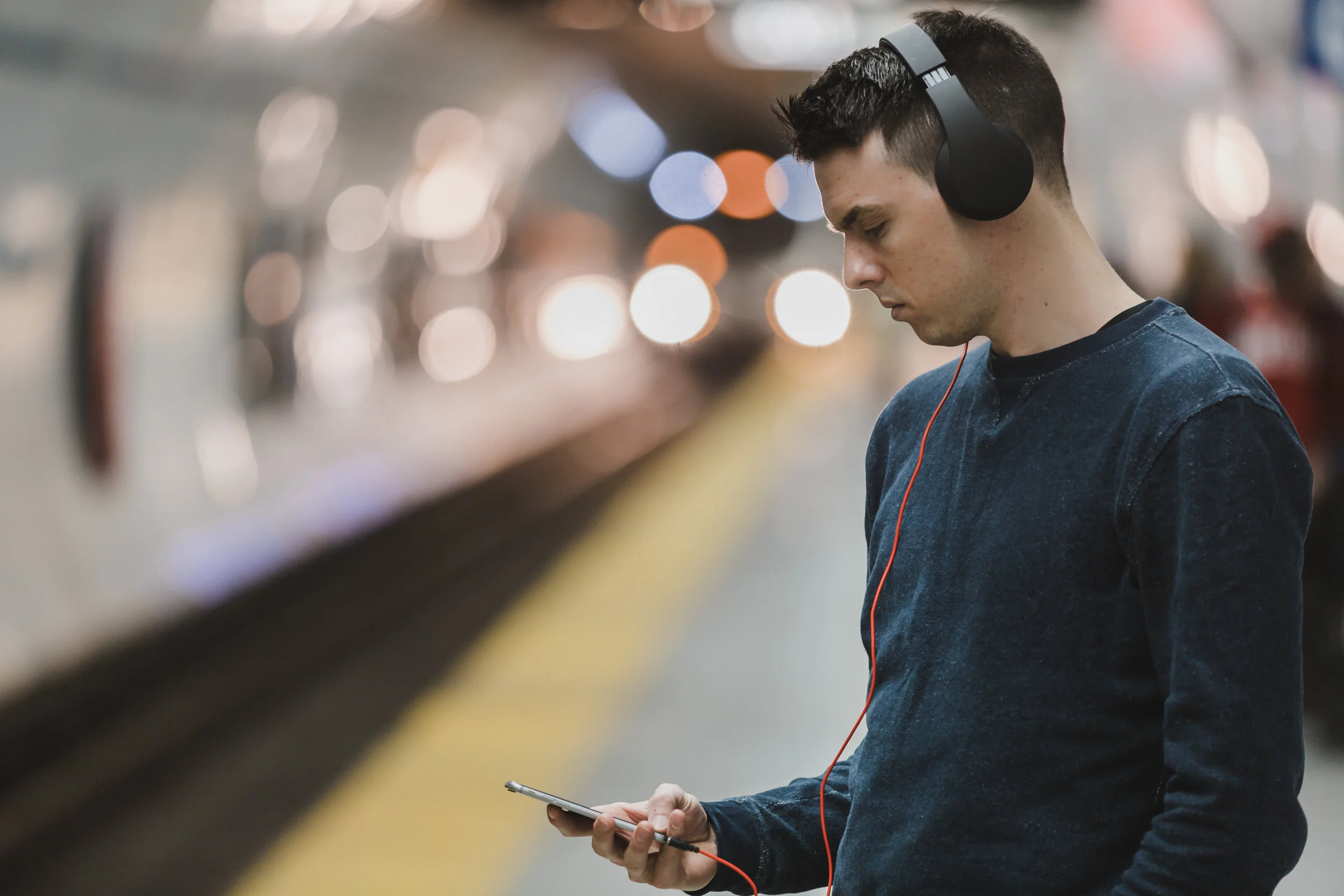 guy-subway-earbuds-forward-facing.jpeg