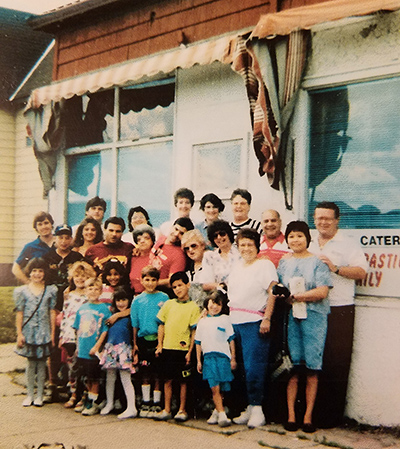 Leah & family in front of Range Catering in Virginia, MN. Owned and operated by her great-grandma Grace Ceryance for 35 years.