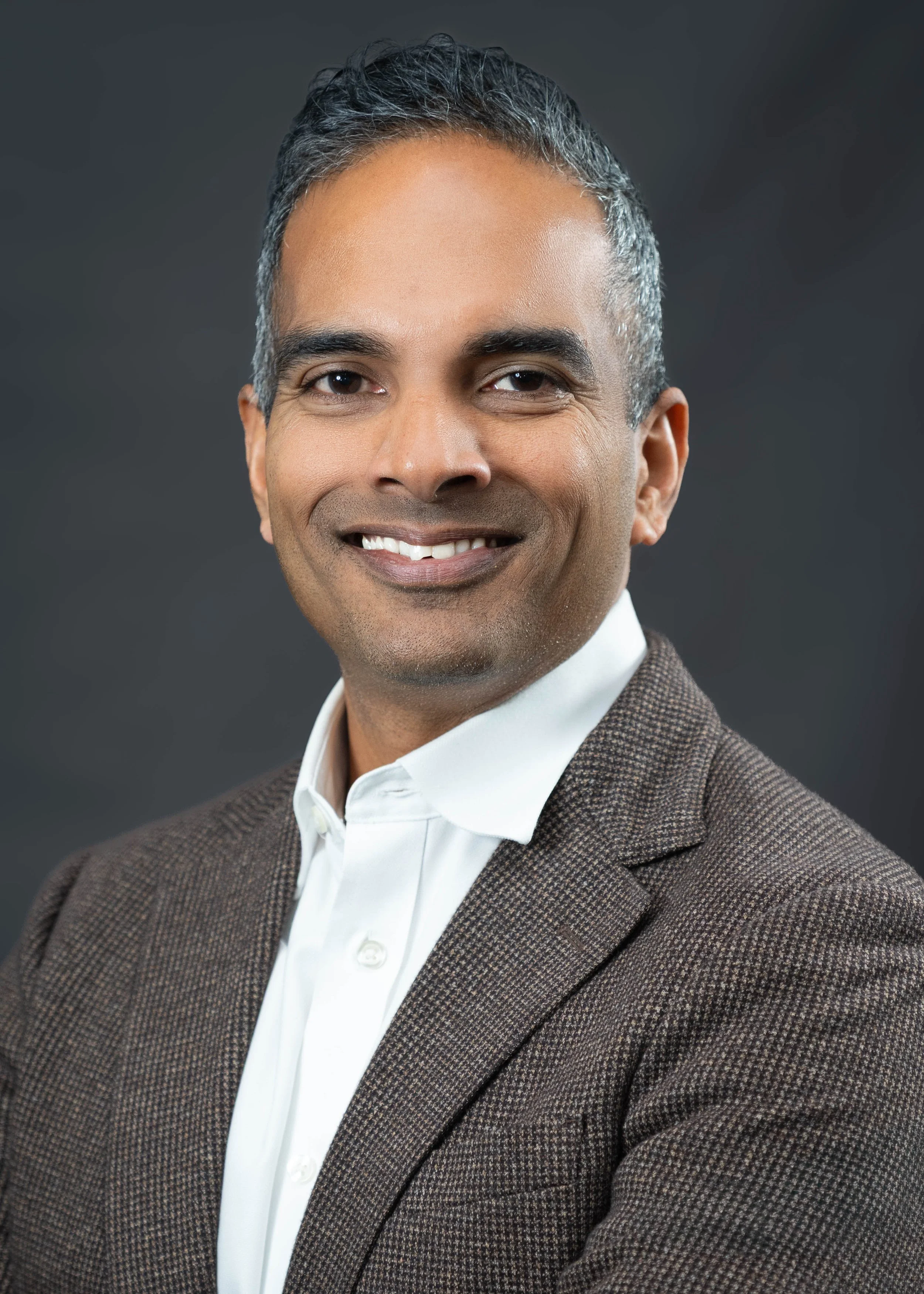 vijit_nair_headshot_2026_FINAL.jpg